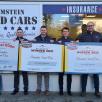 Ramstein Used Car employees with their certificates.